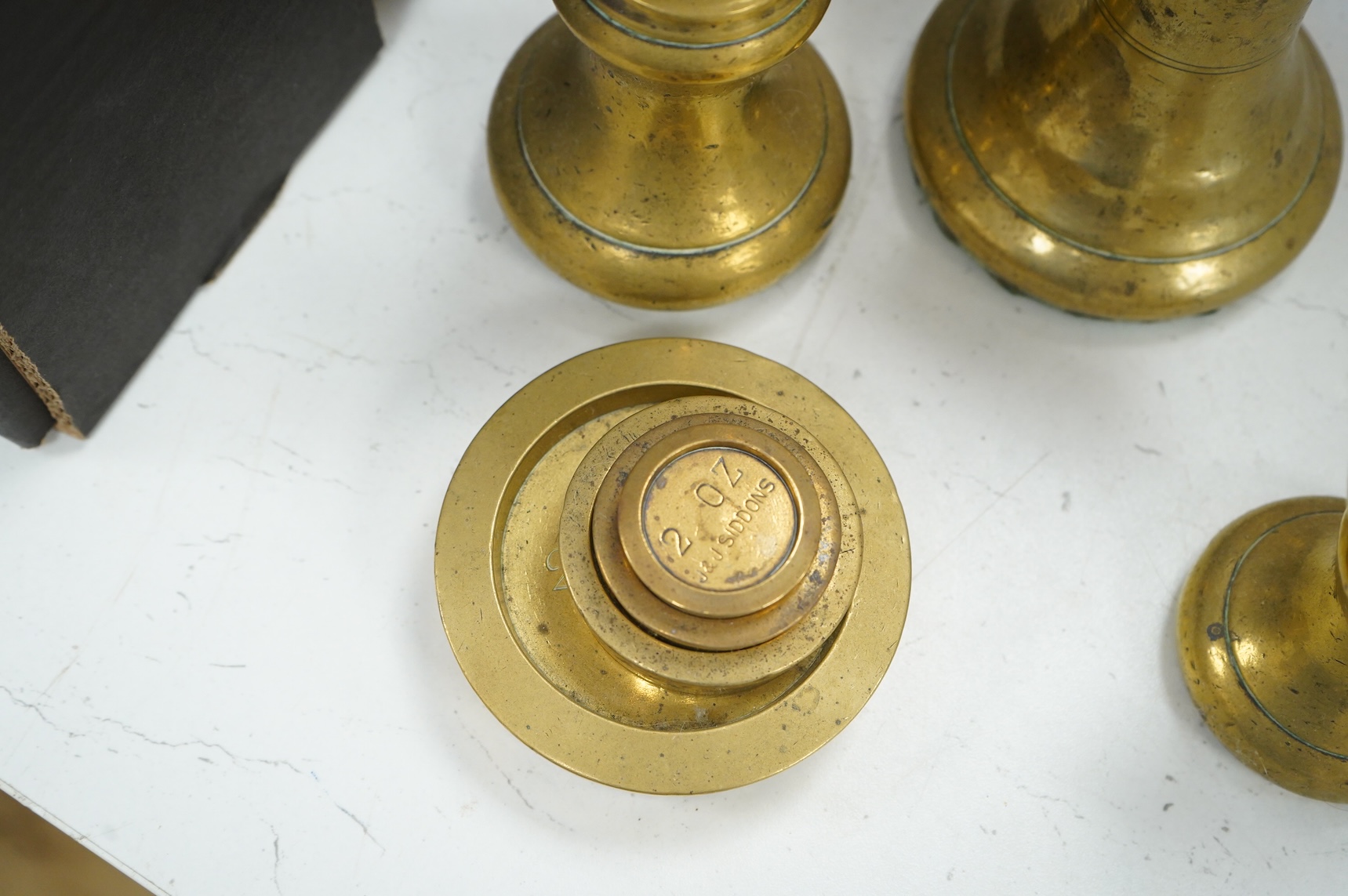 Two leather-cased spirit flasks and graduated set of brass weights